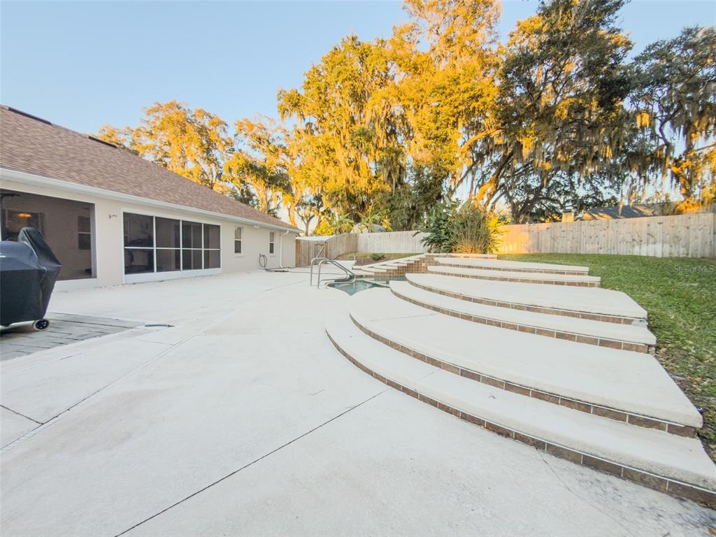4 Weston Road Leesburg, FL 34748 - Photo 54 of 55 a view of a house with a yard and potted plants
