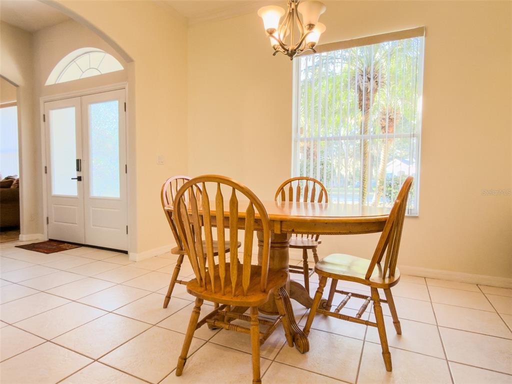 4 Weston Road Leesburg, FL 34748 - Photo 10 of 55 a view of a dining room with furniture and a window