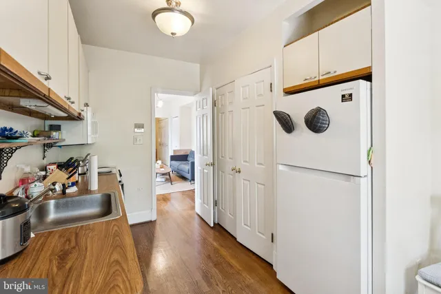 a hallway with washer and dryer