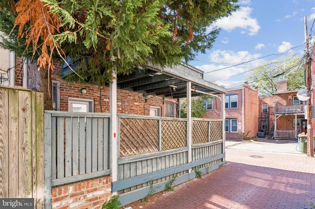 a view of a wrought iron fences in front of house