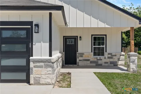 a front view of a house with seating