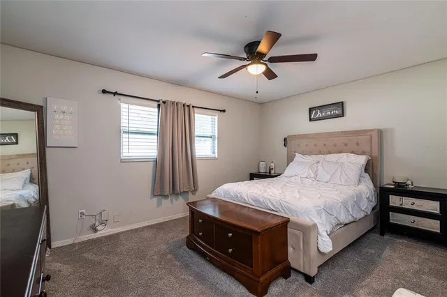 a bedroom with a bed and window