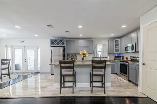 a view of a dining room kitchen with furniture and wooden floor