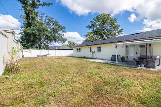 a view of swimming pool with outdoor seating