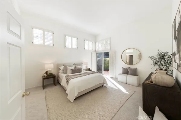 a room with a bed couch and window