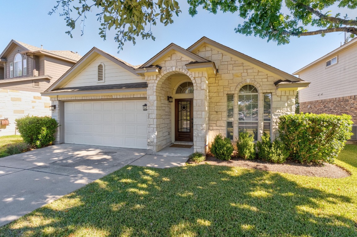 11201 Old Quarry Road Austin, TX 78717 - Photo 3 of 33 a front view of a house with a yard and garage