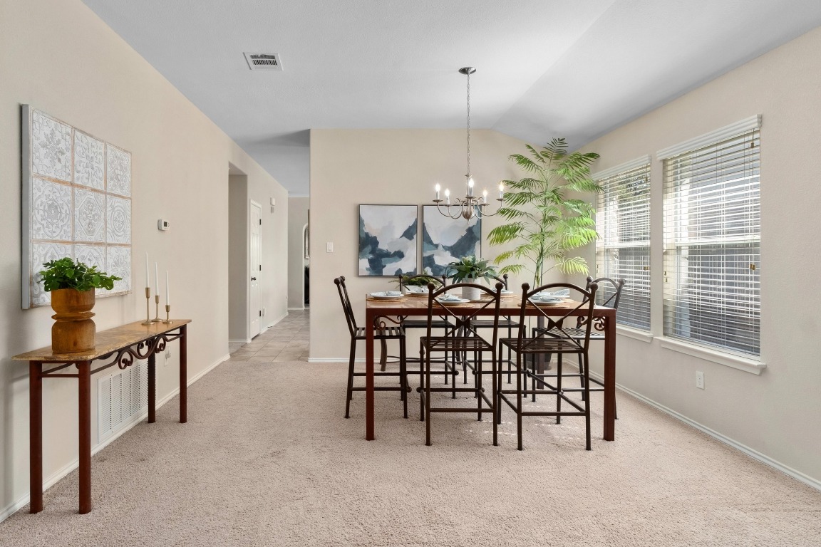 11201 Old Quarry Road Austin, TX 78717 - Photo 4 of 33 a view of a dining room with furniture and chandelier