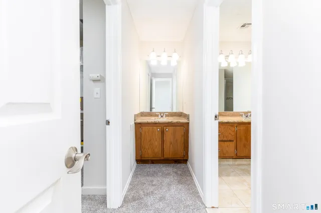 a bathroom with a sink and mirror
