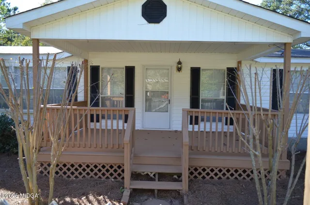 a view of balcony with wooden floor