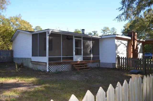 a view of backyard with deck