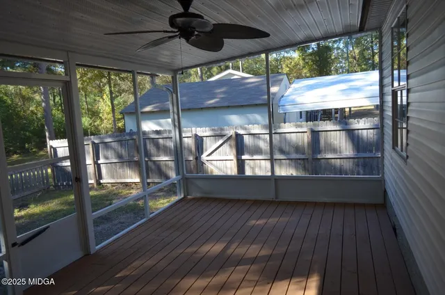 a bedroom with a bed and mirror