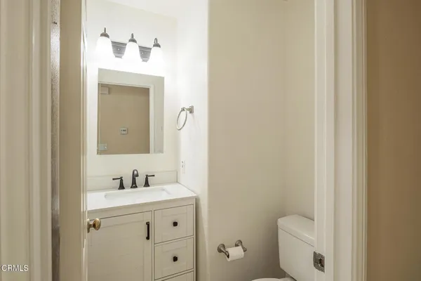 a bathroom with a sink toilet and vanity
