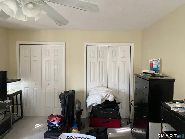 a room with furniture a rug and a window