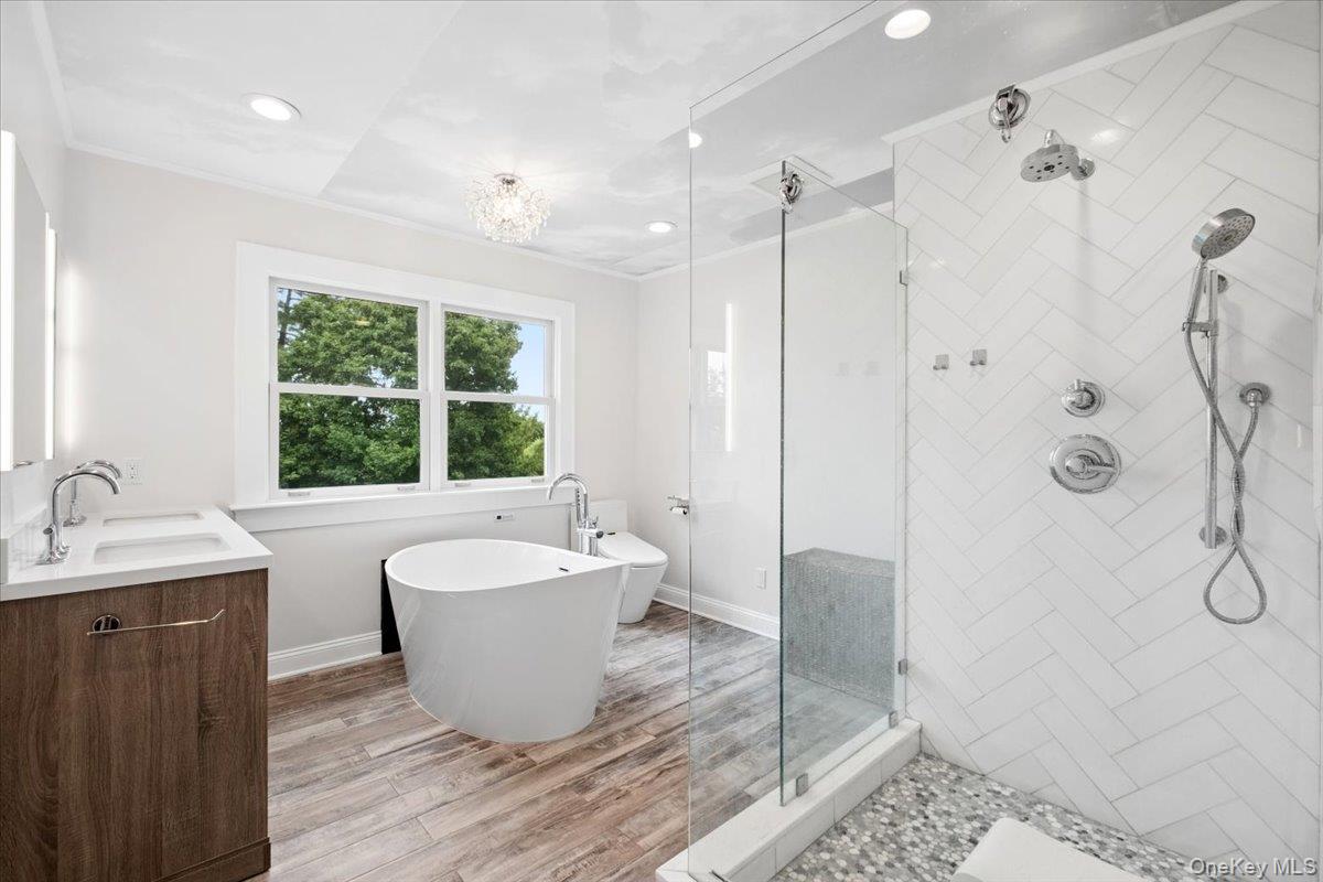 27 Ryder Road Ossining, NY 10562 - Photo 22 of 39 Primary bathroom. Soaking tub takes advantage of the view too.