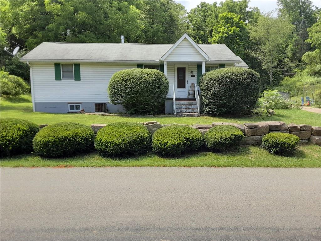 211 Rural Valley Road Claysville, PA 15323 - Photo 1 of 22 a front view of a house with garden