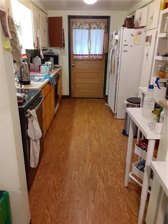 211 Rural Valley Road Claysville, PA 15323 - Photo 11 of 22 a view of a kitchen with fridge and workspace