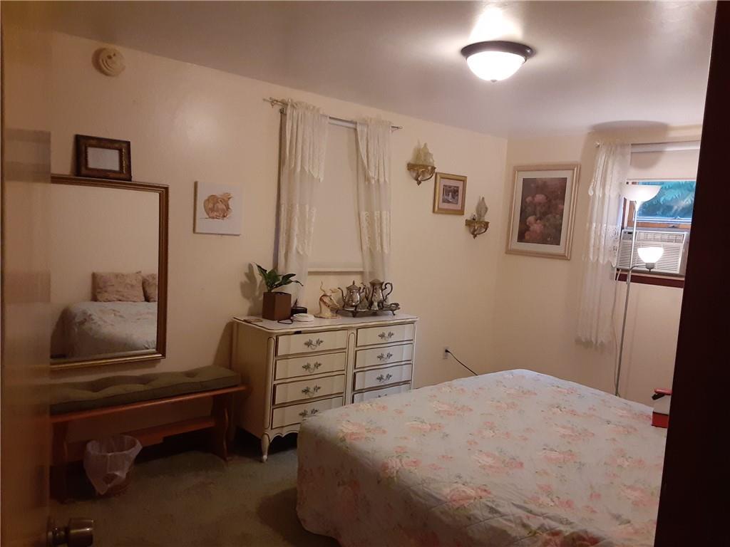 211 Rural Valley Road Claysville, PA 15323 - Photo 14 of 22 a bedroom with a bed and a mirror