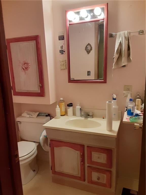 211 Rural Valley Road Claysville, PA 15323 - Photo 15 of 22 a bathroom with a toilet sink and mirror