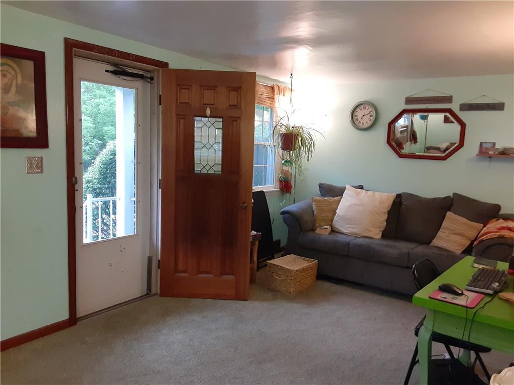 211 Rural Valley Road Claysville, PA 15323 - Photo 9 of 22 a living room with furniture and a window