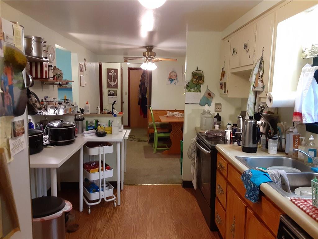 211 Rural Valley Road Claysville, PA 15323 - Photo 10 of 22 a kitchen that has a lot of cabinets a sink and a stove in it