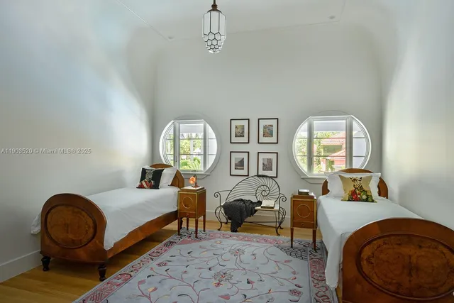 a bedroom with furniture and a window