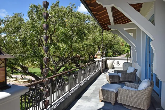 a view of a patio with couches and potted plants