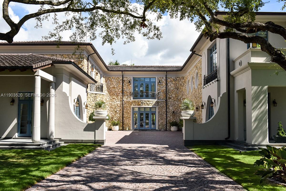 5771 Southwest 94th Street Pinecrest, FL 33156 - Photo 24 of 47 a view of entrance gate of a house