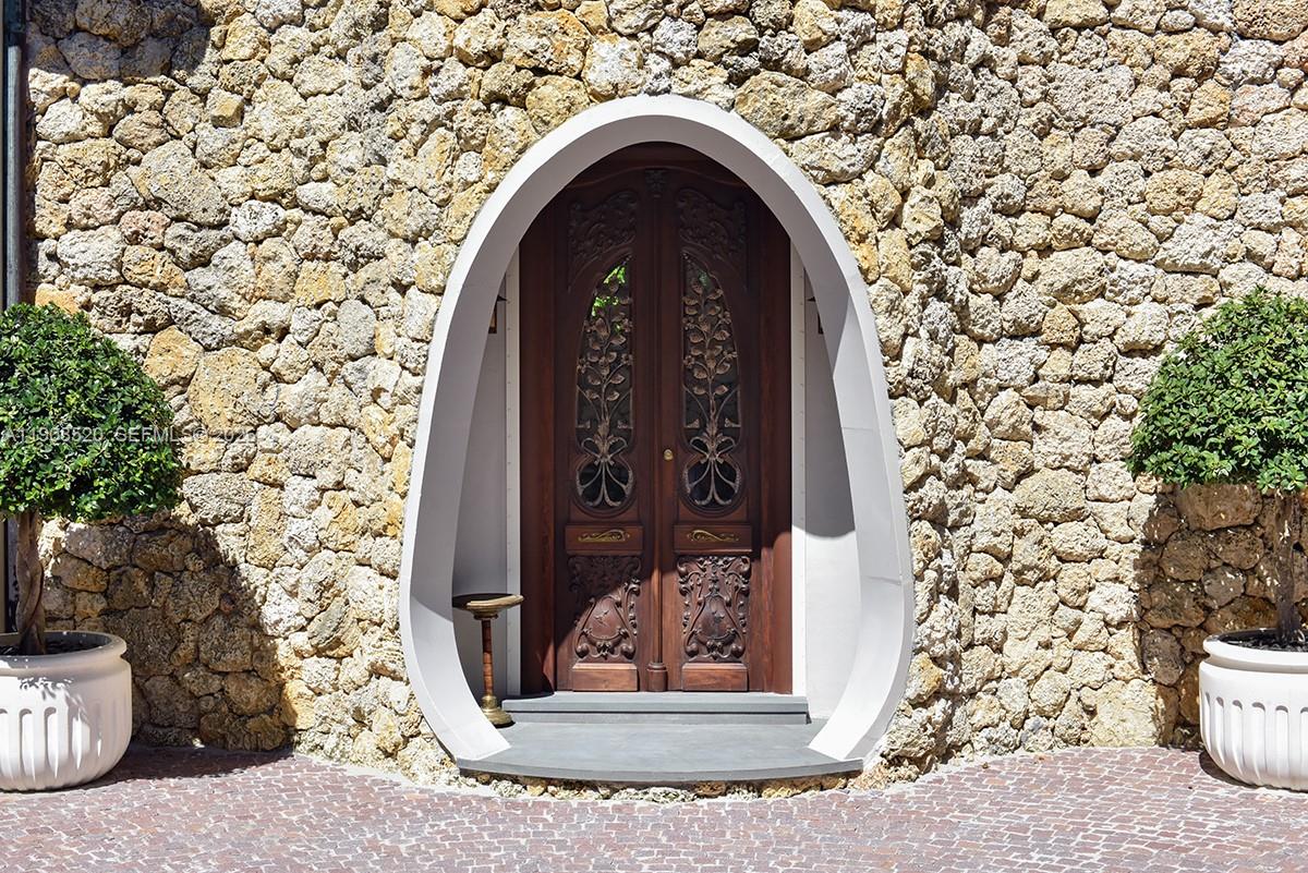5771 Southwest 94th Street Pinecrest, FL 33156 - Photo 25 of 47 a view of a wooden door with a outdoor space