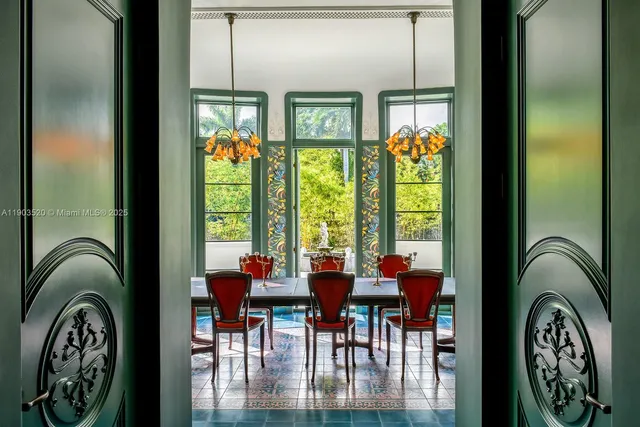 a view of a entryway door dining room and hall with furniture