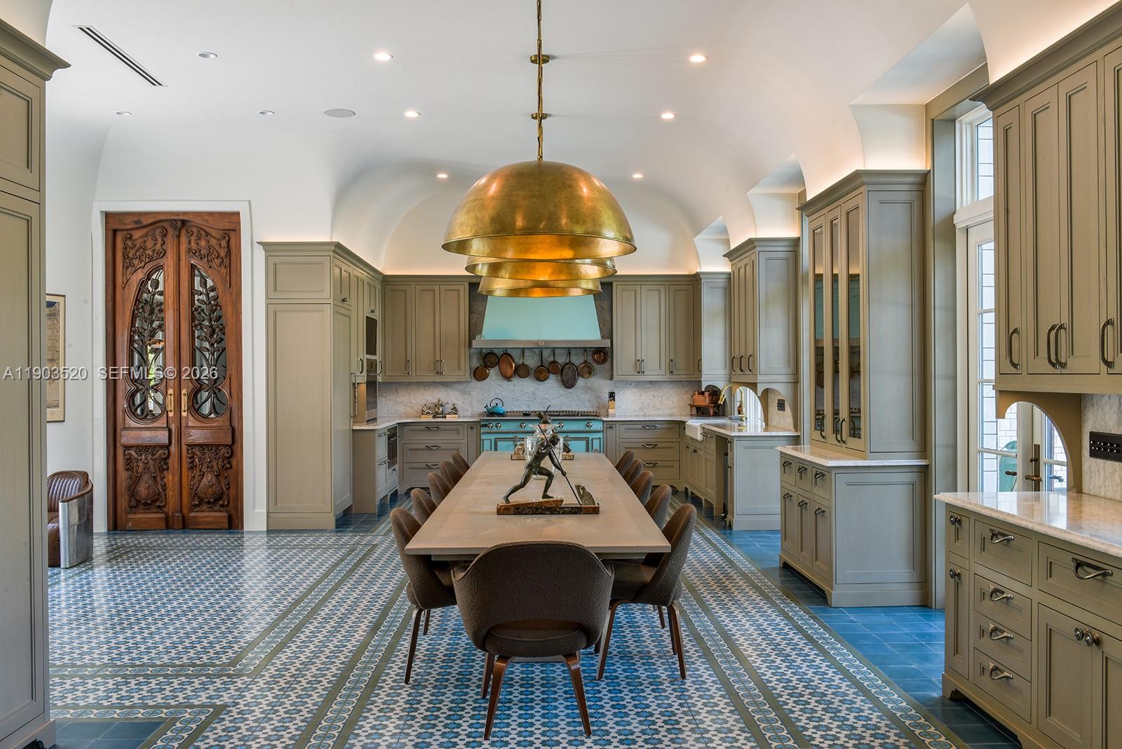 5771 Southwest 94th Street Pinecrest, FL 33156 - Photo 9 of 47 a view of a kitchen center island and furniture