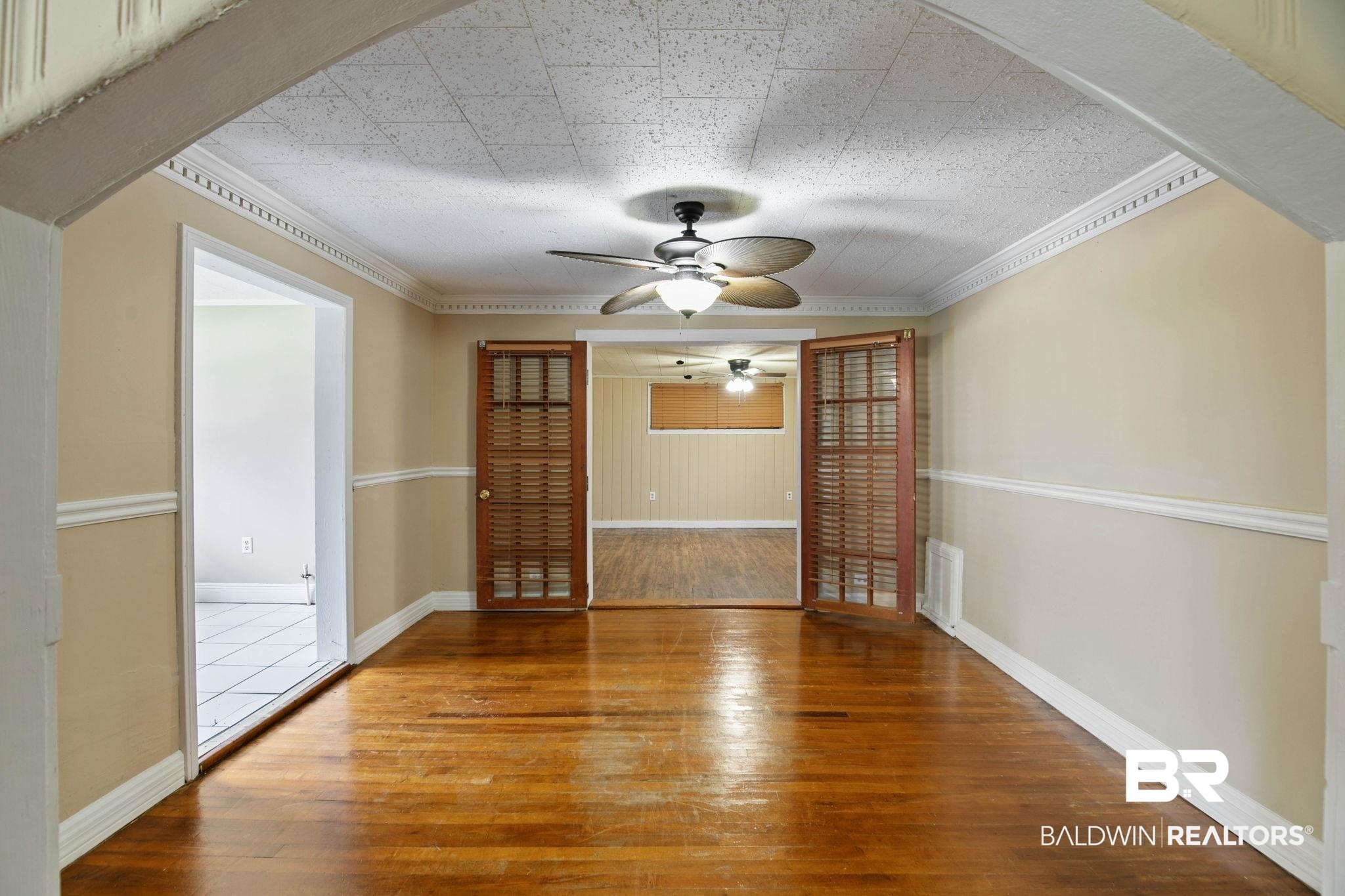 23240 County Road 47 Perdido, AL 36562 - Photo 9 of 29 Empty room with wood-type flooring, ornamental molding, and a ceiling fan