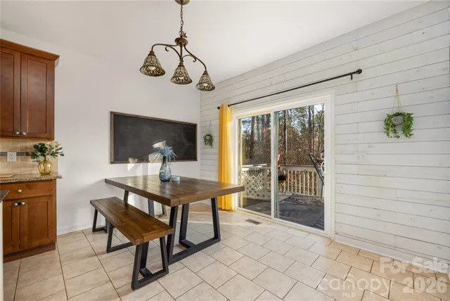 a view of a livingroom with furniture and a window