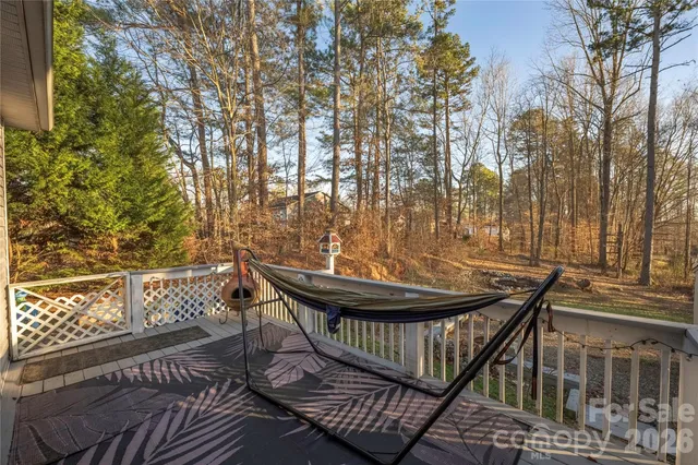 a view of balcony with wooden floor and outdoor seating