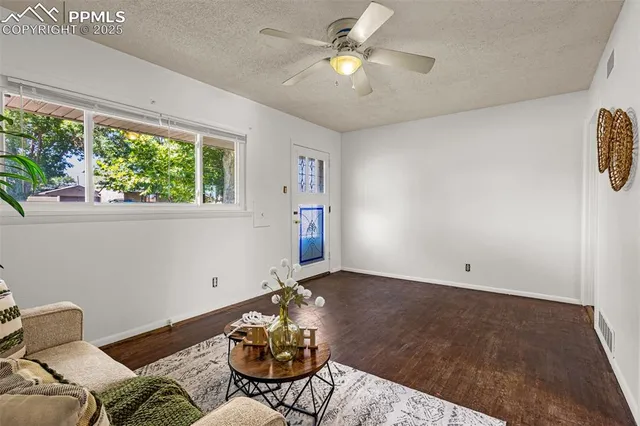 a living room with furniture and a table