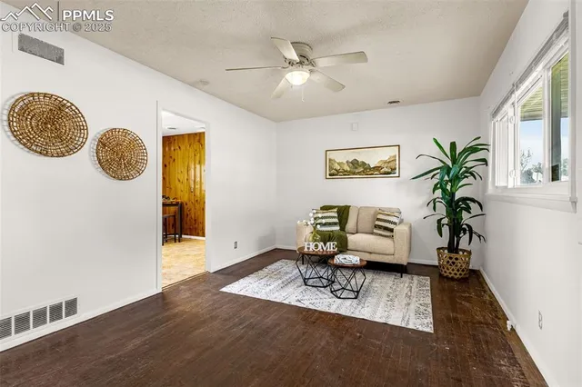 a living room with furniture and a table