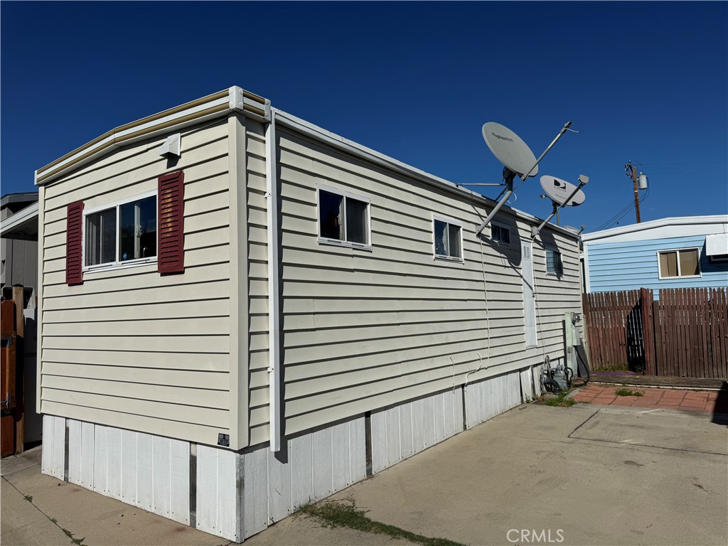 3825 Valley Boulevard, Unit 58 Walnut, CA 91789 - Photo 2 of 11 a front view of a house with a garage