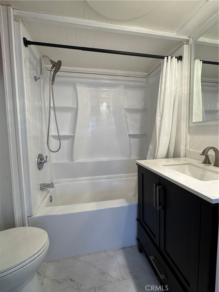3825 Valley Boulevard, Unit 58 Walnut, CA 91789 - Photo 8 of 11 a bathroom with a sink toilet and shower
