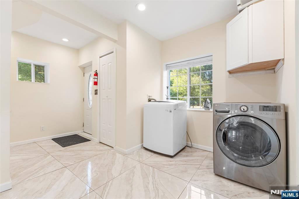 234 Liberty Road Teaneck, NJ 07666 - Photo 12 of 42 a view of kitchen with washer and dryer