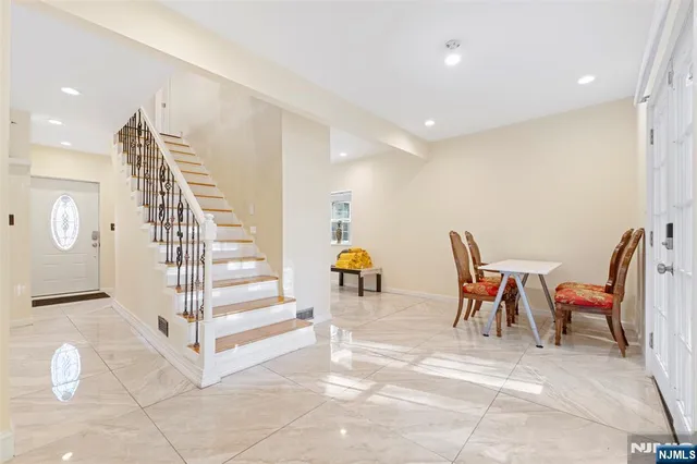 a view of dining room with furniture and stairs