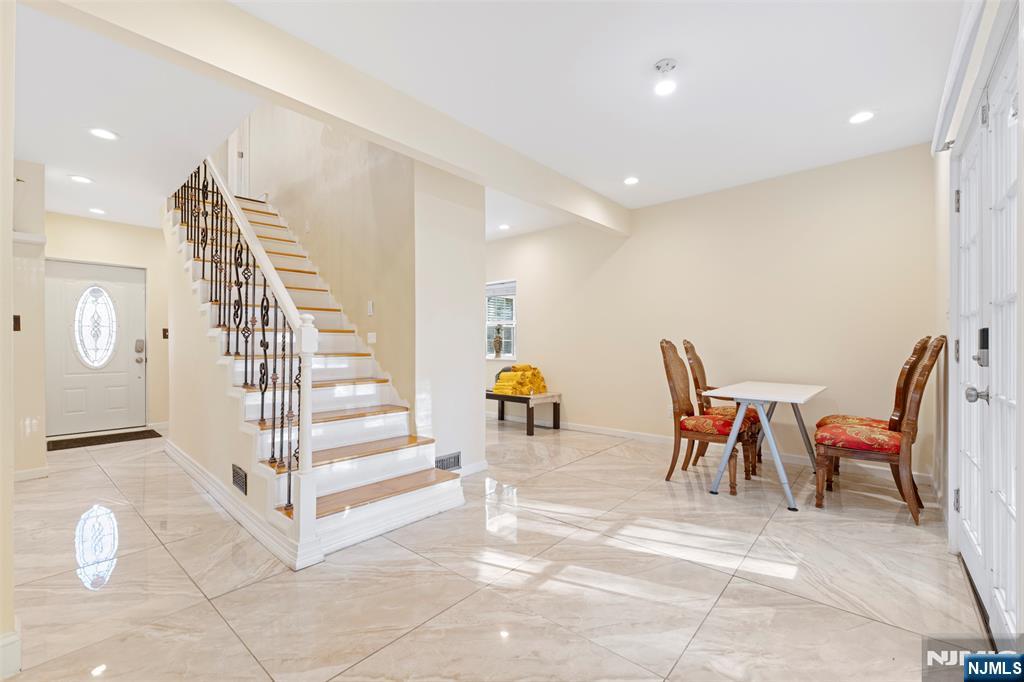 234 Liberty Road Teaneck, NJ 07666 - Photo 13 of 42 a view of dining room with furniture and stairs