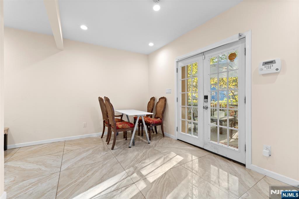 234 Liberty Road Teaneck, NJ 07666 - Photo 14 of 42 a view of a dining room with furniture window and outside view