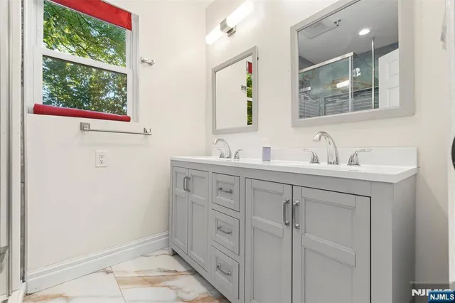 a bathroom with a sink and a mirror