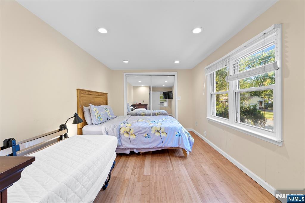 234 Liberty Road Teaneck, NJ 07666 - Photo 19 of 42 a bedroom with a bed and wooden floor