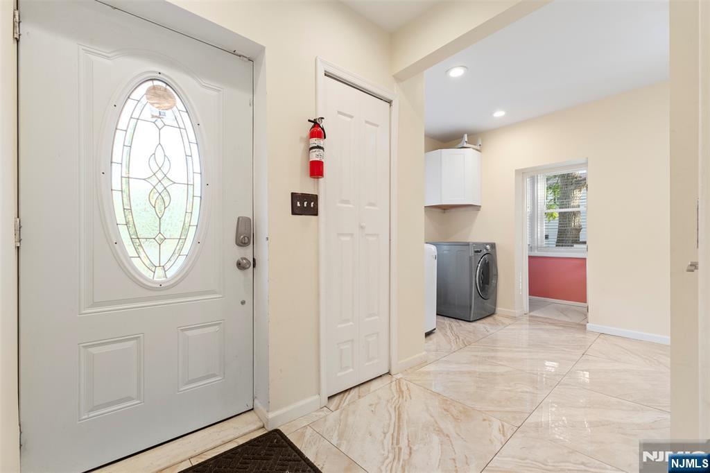 234 Liberty Road Teaneck, NJ 07666 - Photo 3 of 42 a view of an empty room with a window