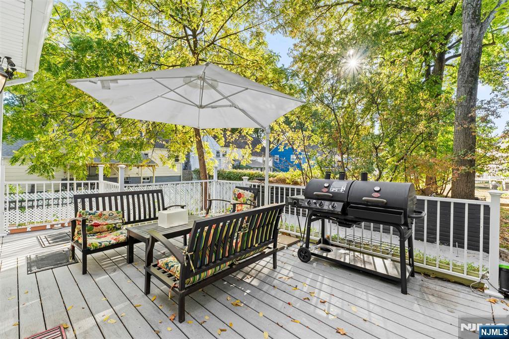 234 Liberty Road Teaneck, NJ 07666 - Photo 31 of 42 a view of a wooden deck with furniture
