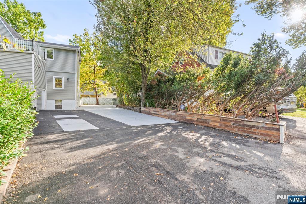 234 Liberty Road Teaneck, NJ 07666 - Photo 34 of 42 a view of a yard with plants and trees