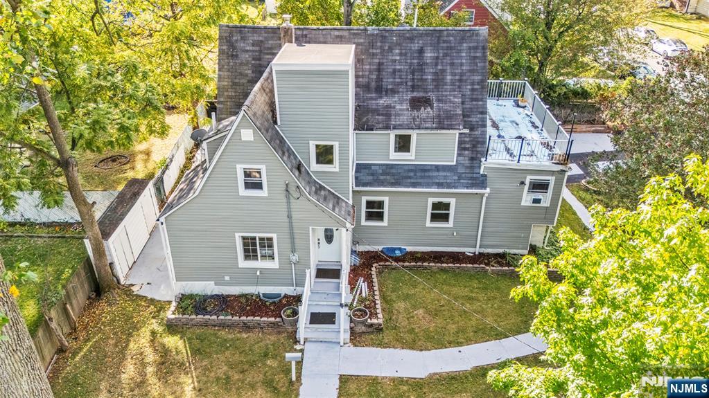 234 Liberty Road Teaneck, NJ 07666 - Photo 38 of 42 a front view of a house with a yard