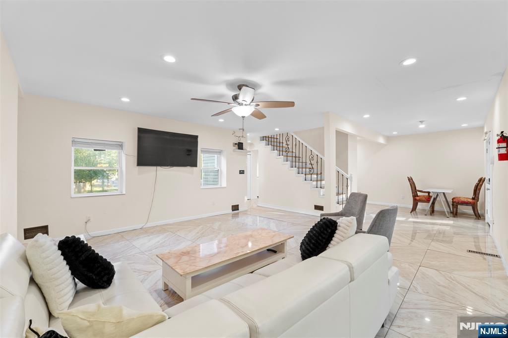 234 Liberty Road Teaneck, NJ 07666 - Photo 4 of 42 a living room with furniture and a flat screen tv