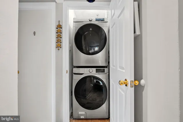 a close view of a utility room with dryer and washer
