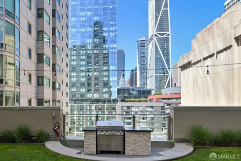 a large white kitchen with a large window